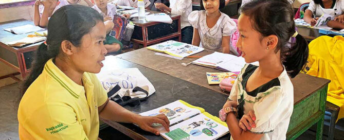 Teacher and student at the Andaman Center for Migrant Education