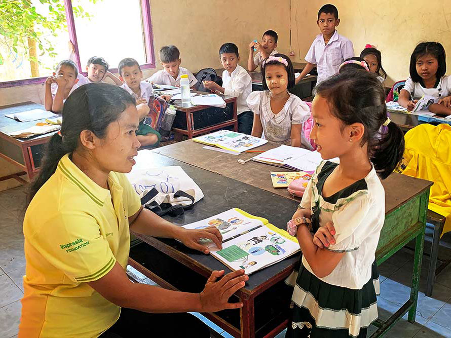 Teacher and student at the Andaman Center for Migrant Education