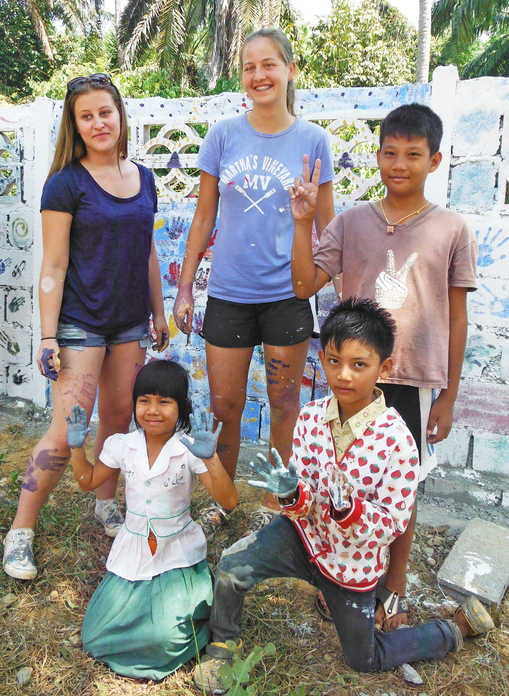 Decorating a wall with the students